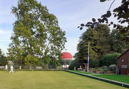 Hot air balloon near the bowls green